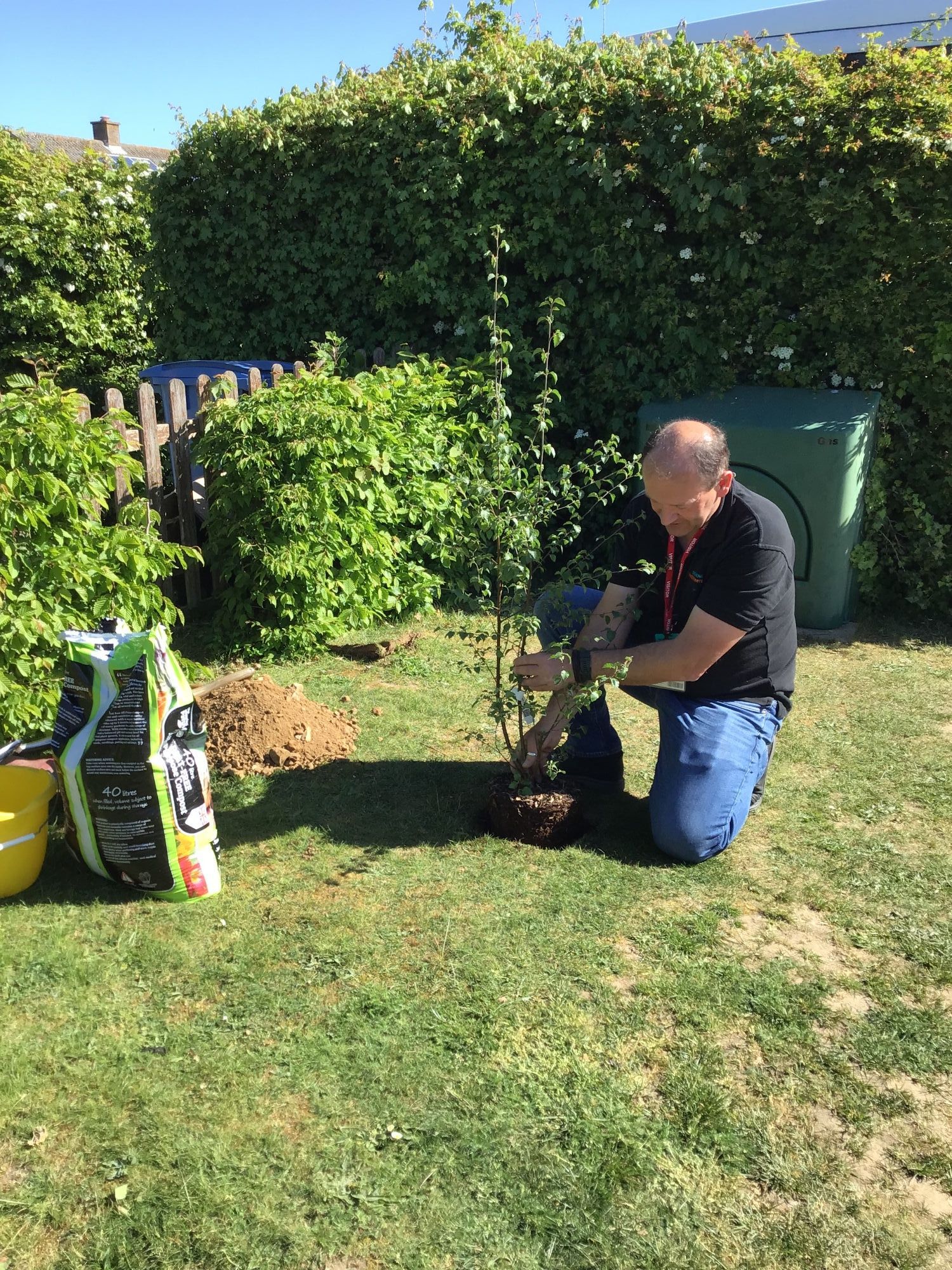 Mr Prall planting a tree